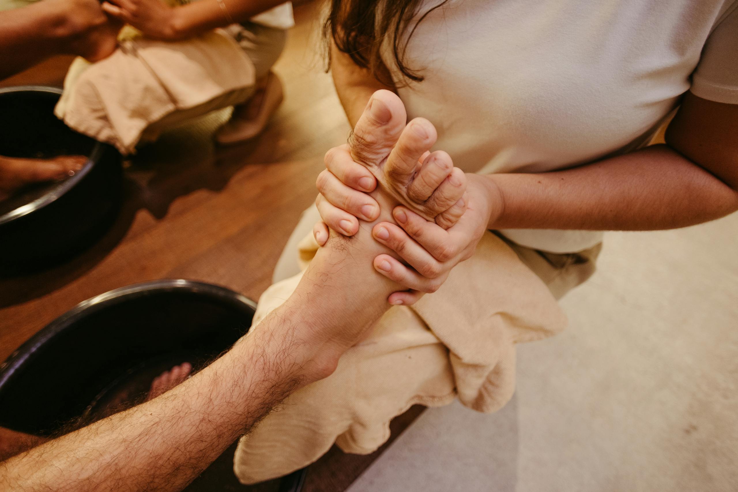 A relaxing foot massage being administered in a serene spa setting for ultimate relaxation.